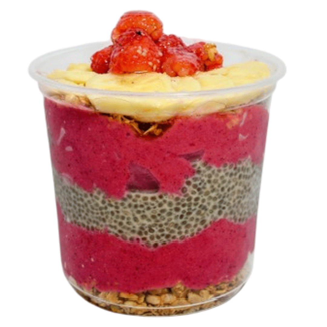 Pink berry smoothie bowl layered with chia pudding, banana slices, strawberries, and granola