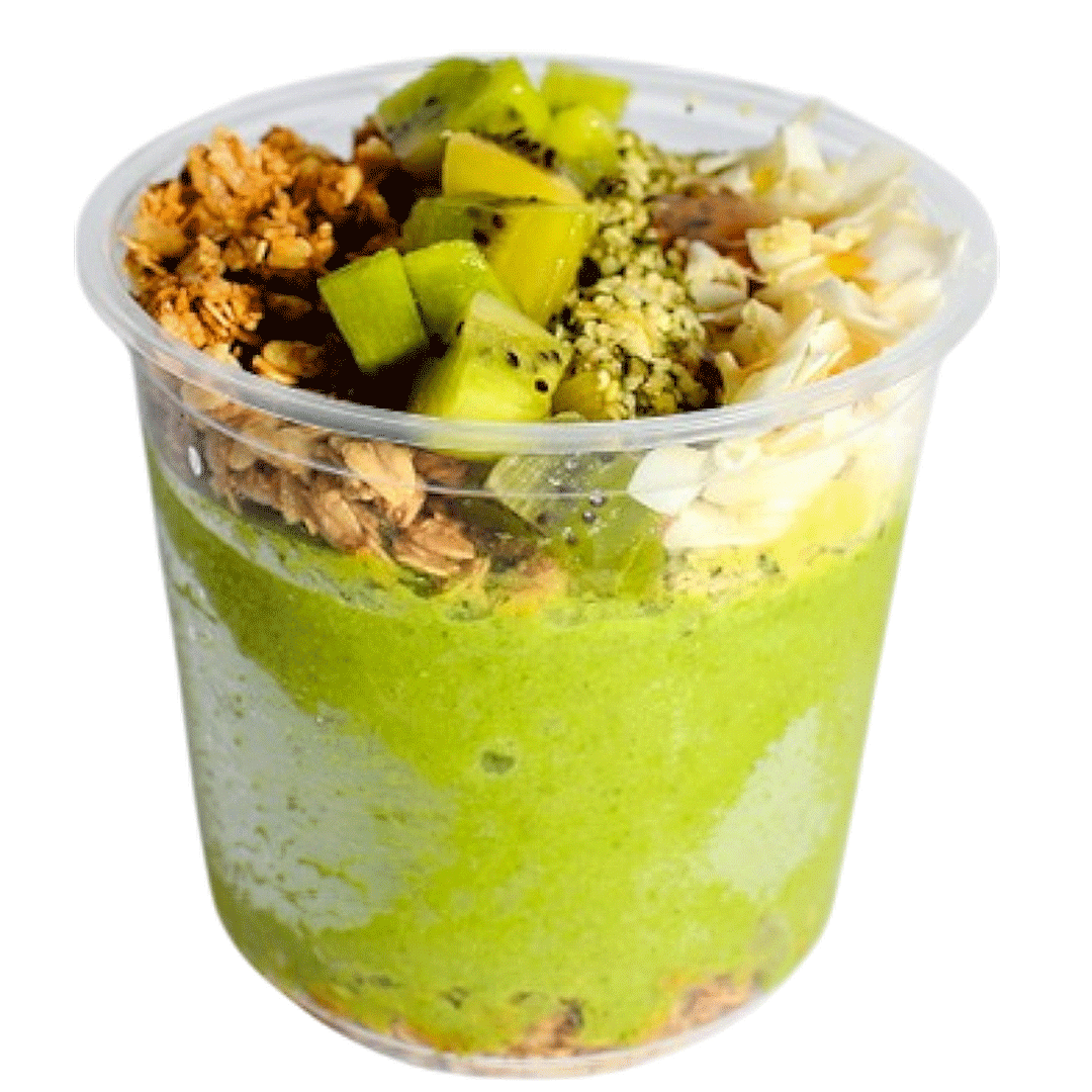 Green smoothie bowl topped with kiwi, pineapple, granola, hemp seeds, and coconut flakes